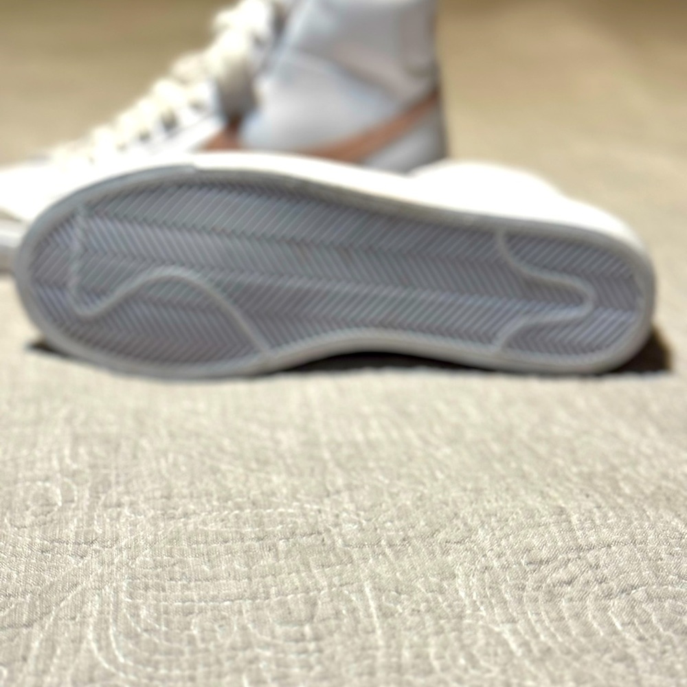 Nike high top blazers pink and white.